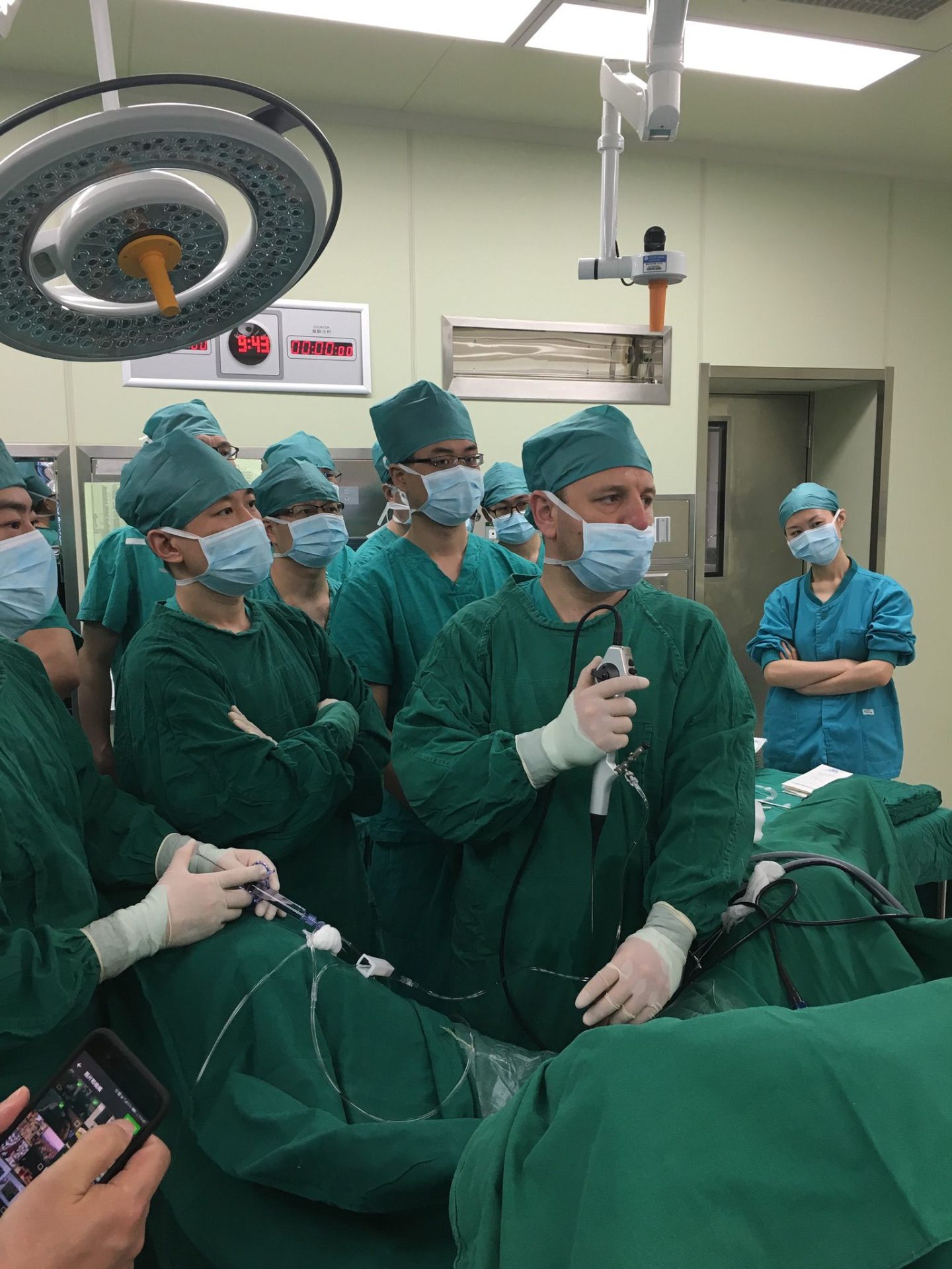 Mr Oliver Wiseman operating with the surgical microscope